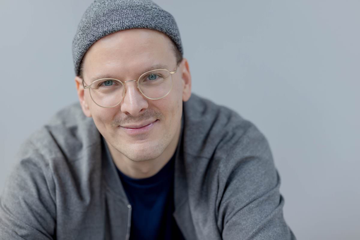 Close-up portrait of DJ Phil wearing a grey beanie hat