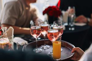 A waitress serves drinks at an after-trade fair event in Cologne.