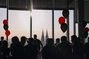 Guests at an after-trade fair event in Cologne chat to the background sounds of DJ Markus Rosenbaum.