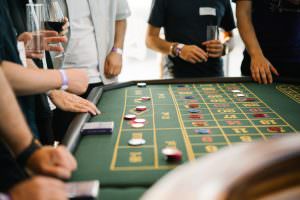 Networking and casino flair: Guests at Heroic Labs' 10th anniversary at the roulette table with DJ accompaniment.