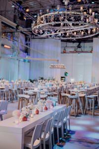 The event hall at Lofthaus Düsseldorf is being prepared for the anniversary celebration of the Toni Kroos Foundation with professional DJ accompaniment.