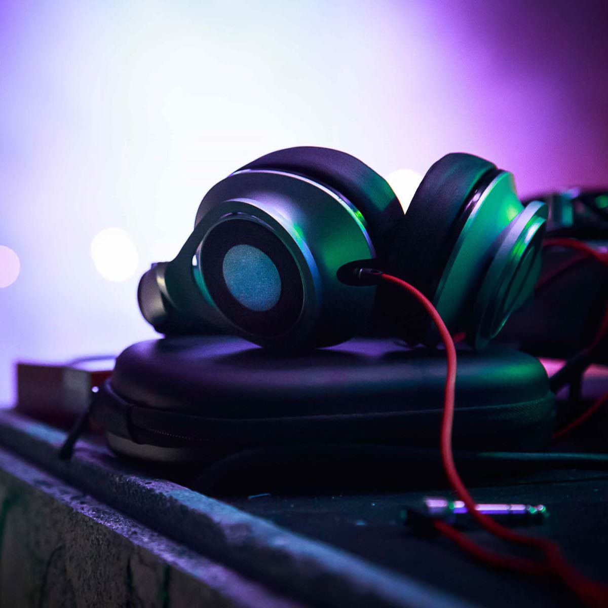 DJ headphones are on a mixing desk in an event venue.