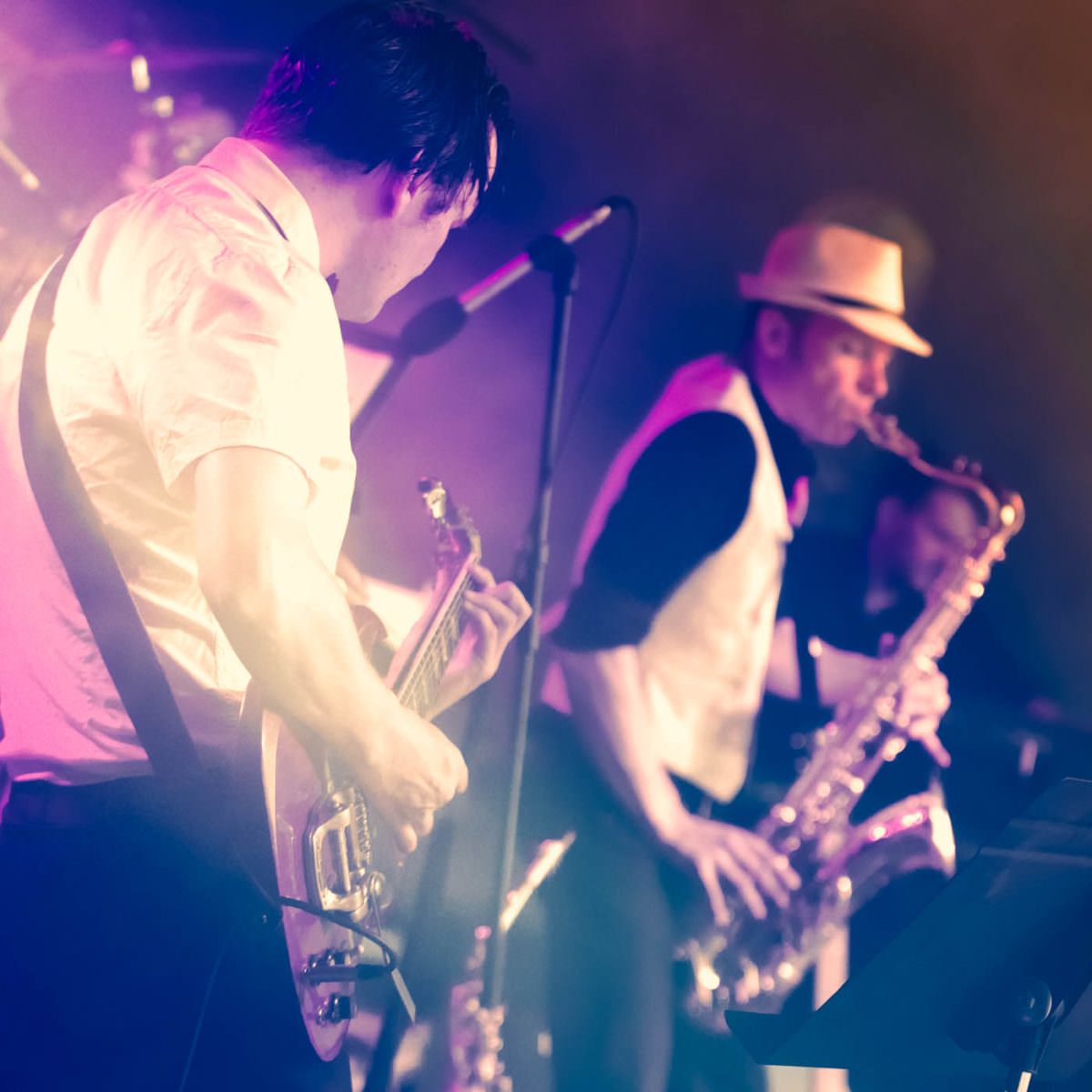 a duo of saxophonist and guitarist playing live music